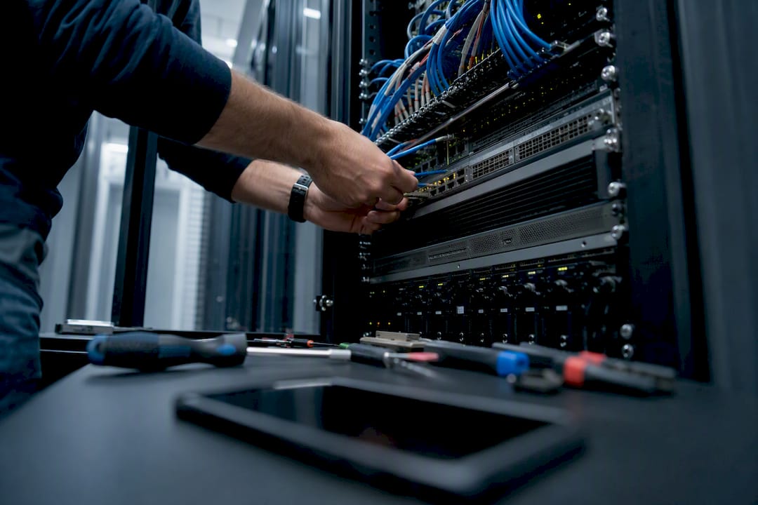 Hands wiring server rack for consent mode