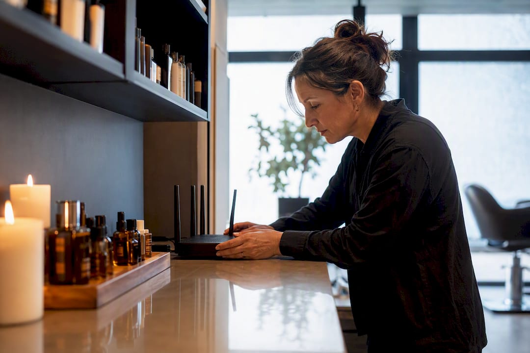 Salon owner adjusting marketing equipment