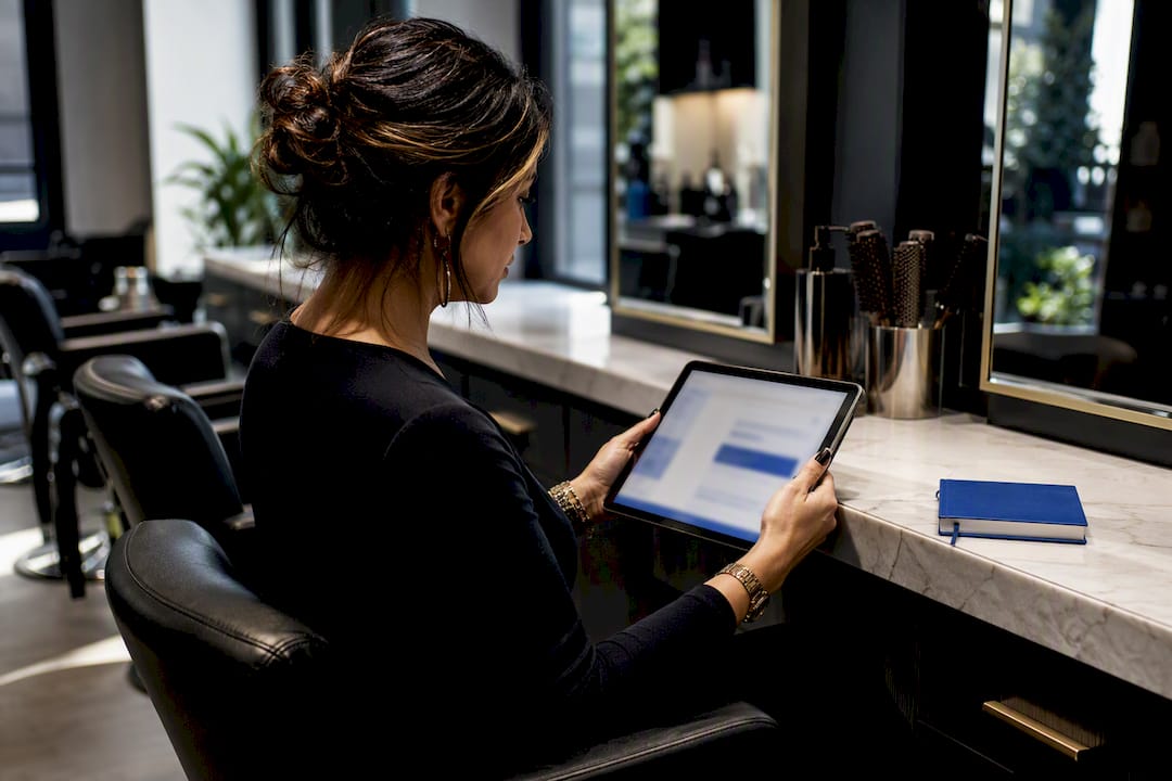 Salon owner reviewing AI marketing draft