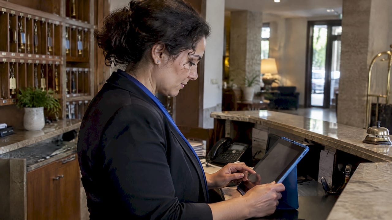 Manager reviewing hotel booking rates