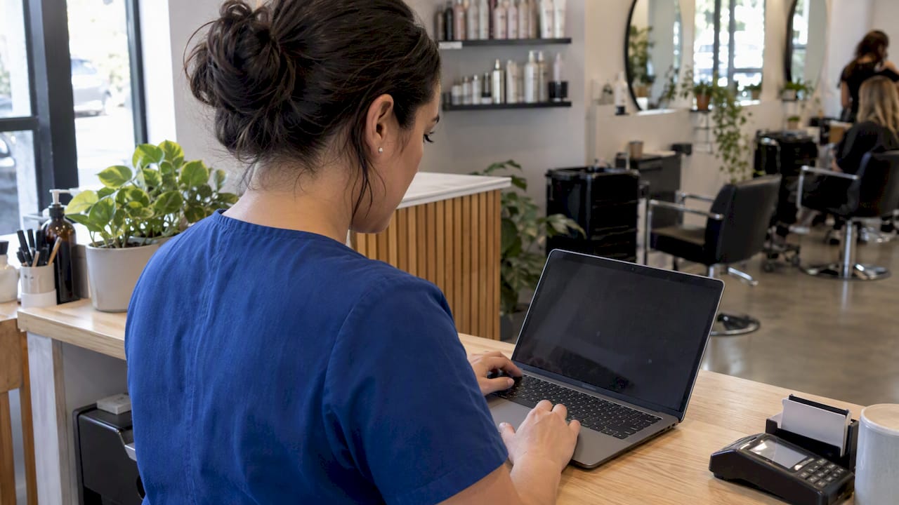 Salon manager testing an online appointment booking